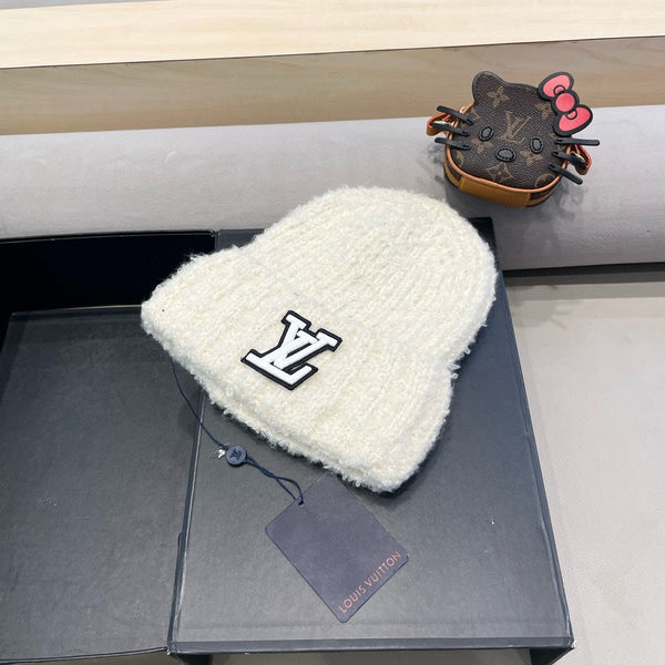 BERRETTO IN MAGLIA DI LANA BIANCA 421265