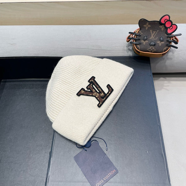 BERRETTO IN MAGLIA IN PILE E LANA BEIGE 426207