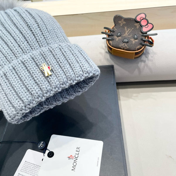 BERRETTO IN LANA CON POM POM GRIGIO CHIARO 435050