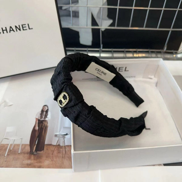 CERCHIETTO IN TESSUTO NERO CON LOGO ORO 414448