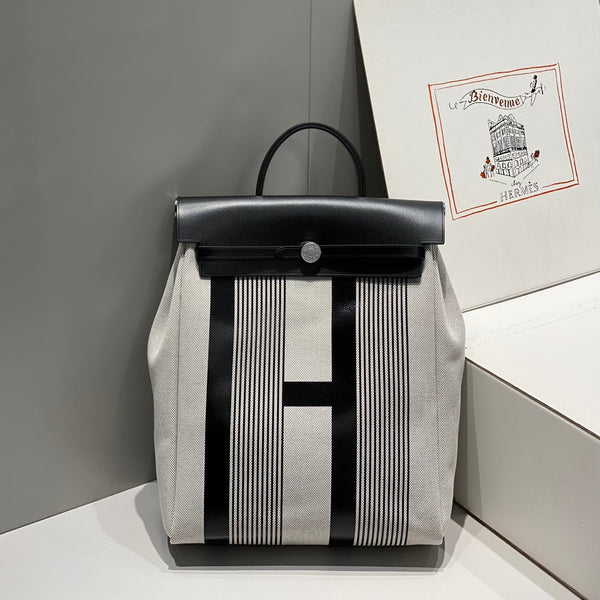 HERBAG A DOS ZIP RETOURNE BACKPACK 29 IN OFF-WHITE MIX BLACK CANVAS AND CALFSKIN