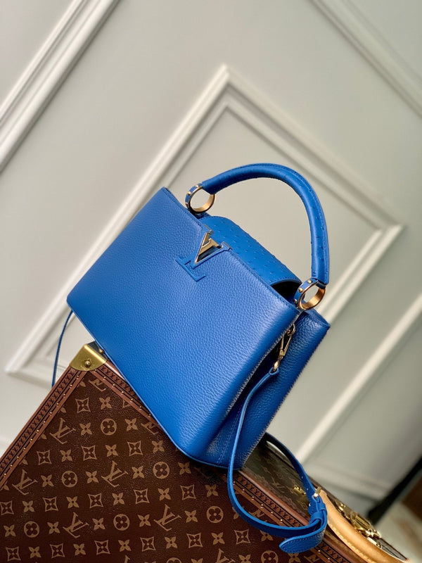 capucines mm 31.5 cobalt blue taurillon leather gold hardware