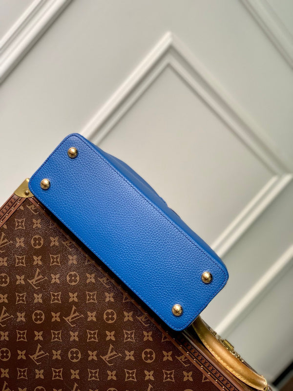 capucines mm 31.5 cobalt blue taurillon leather gold hardware