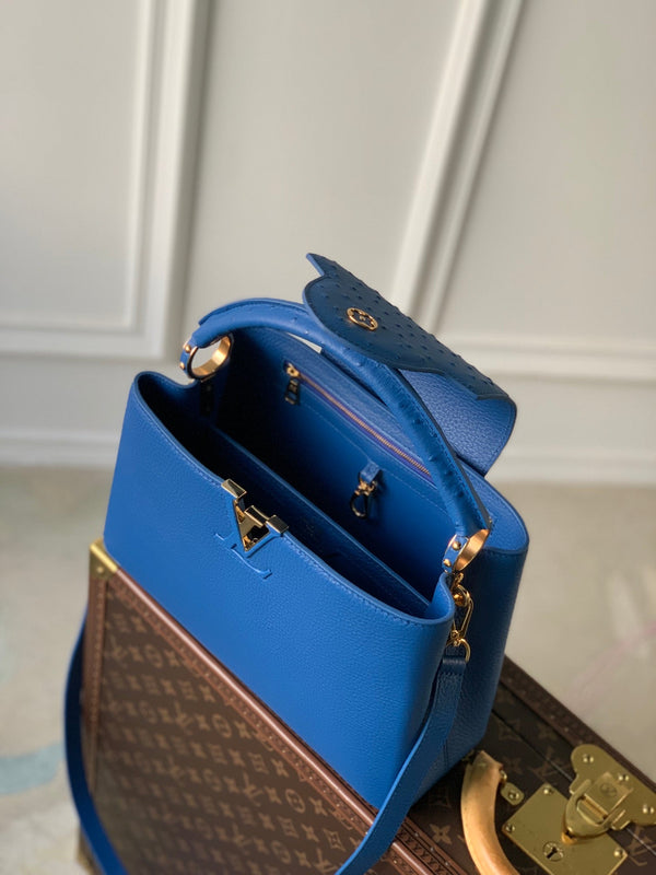 capucines mm 31.5 cobalt blue taurillon leather gold hardware