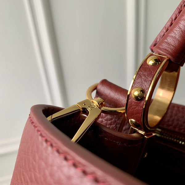 capucines mm 31.5 burgundy taurillon leather gold hardware