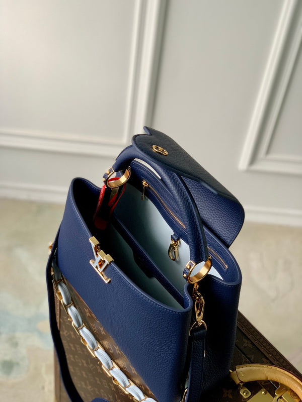 capucines mm 31.5 dark blue taurillon leather gold hardware