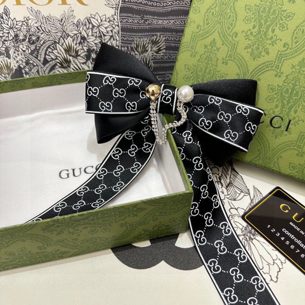 PINCE À CHEVEUX AVEC NŒUD EN RE-NYLON NOIR ET PERLE 358260