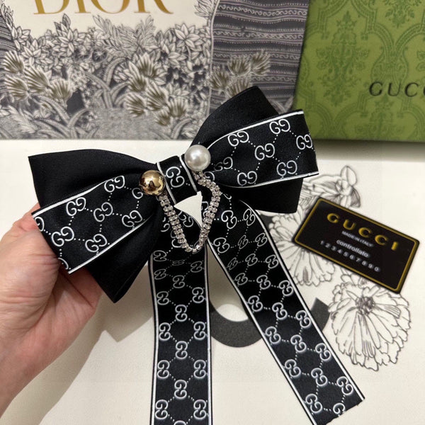 PINCE À CHEVEUX AVEC NŒUD EN RE-NYLON NOIR ET PERLE 358260