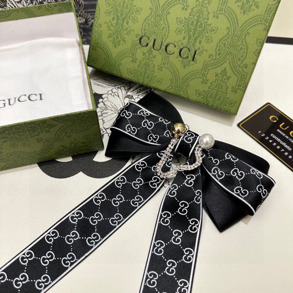 PINCE À CHEVEUX AVEC NŒUD EN RE-NYLON NOIR ET PERLE 358260