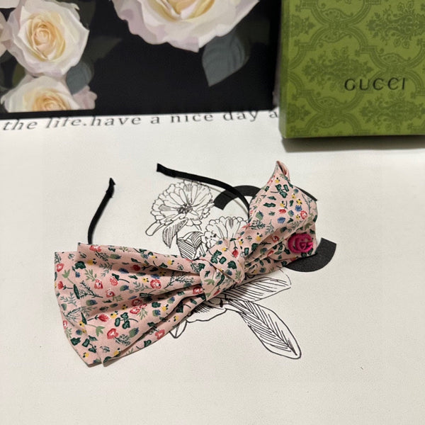 CERCHIETTO IN TESSUTO FLOREALE ROSA CHIARO 385853