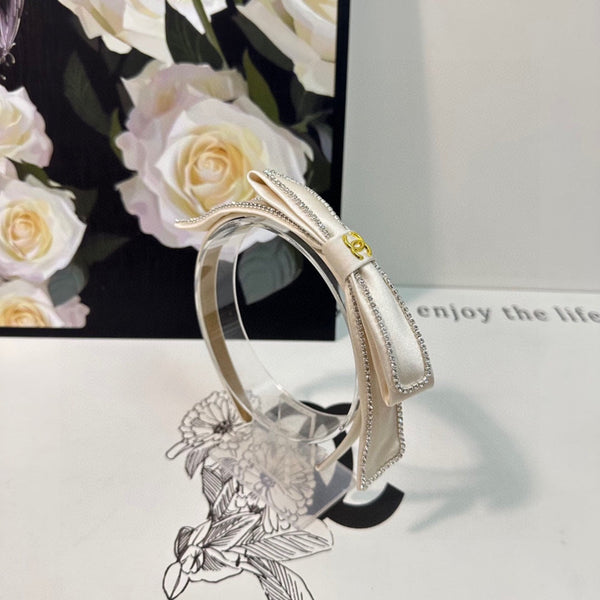 CERCHIETTO IN TESSUTO BIANCO CON CRISTALLI 412464