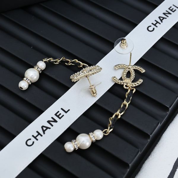 DOUBLE C CHAIN DETAIL EARRINGS IN GOLD METAL WITH LAMBSKIN TASSEL PEARL AND CRYSTAL LOGO