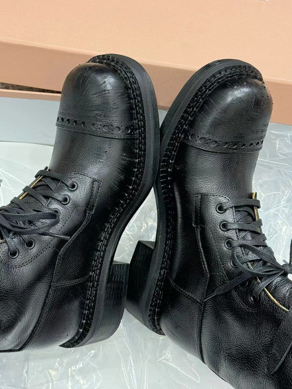 Bottes Miu à talon haut en veau verni noir