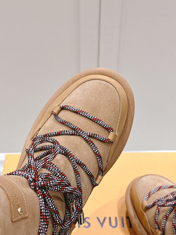 ASPEN PLATFORM ANKLE BOOT IN CIDER BROWN MONOGRAM DEBOSSED SUEDE AND SHEARLING