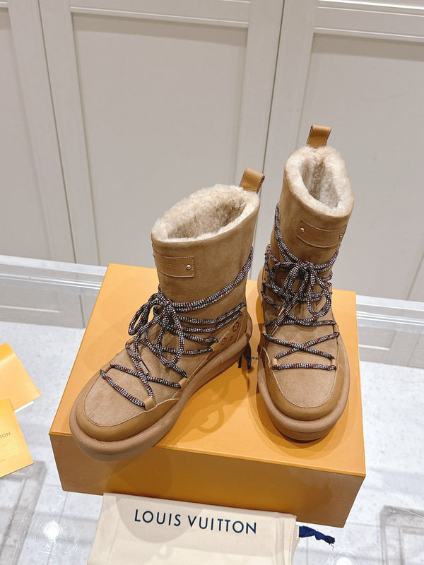 ASPEN PLATFORM ANKLE BOOT IN CIDER BROWN MONOGRAM DEBOSSED SUEDE AND SHEARLING