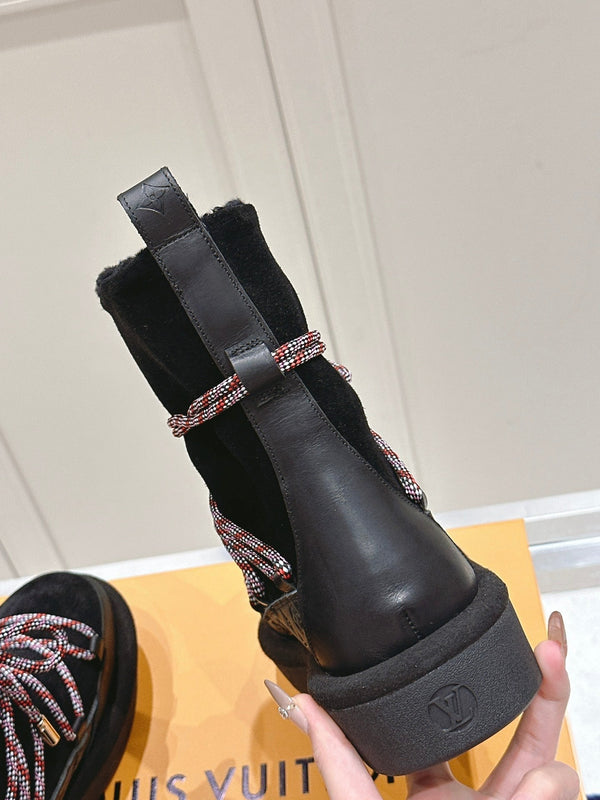 ASPEN PLATFORM ANKLE BOOT IN BLACK MONOGRAM DEBOSSED SUEDE AND SHEARLING