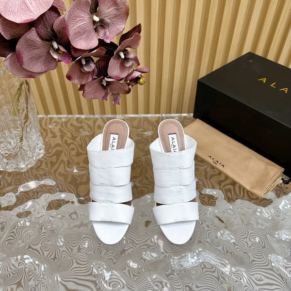 ALAIA ELASTIC CAGE MULE SANDALS IN WHITE WOVEN STRAP AND LAMBSKIN