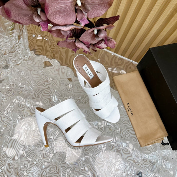 ALAIA ELASTIC CAGE MULE SANDALS IN WHITE WOVEN STRAP AND LAMBSKIN