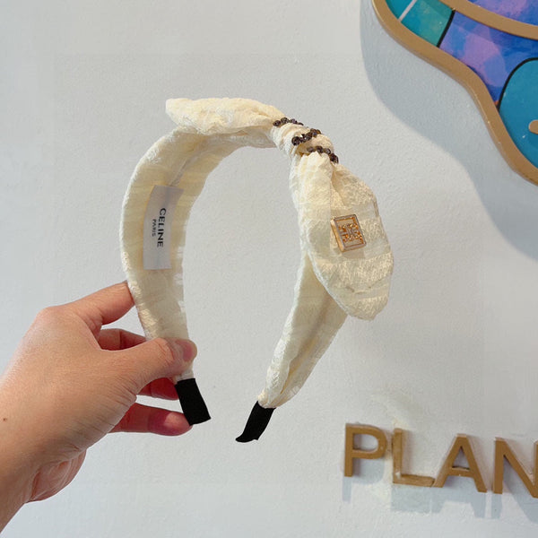 WHITE CREAM VOILE FABRIC WITH GOLD LOGO 391641