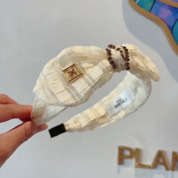 WHITE CREAM VOILE FABRIC WITH GOLD LOGO 391641