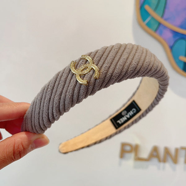 SERRE-TÊTE EN TISSU MARRON KAKI AVEC LOGO DORÉ 414435