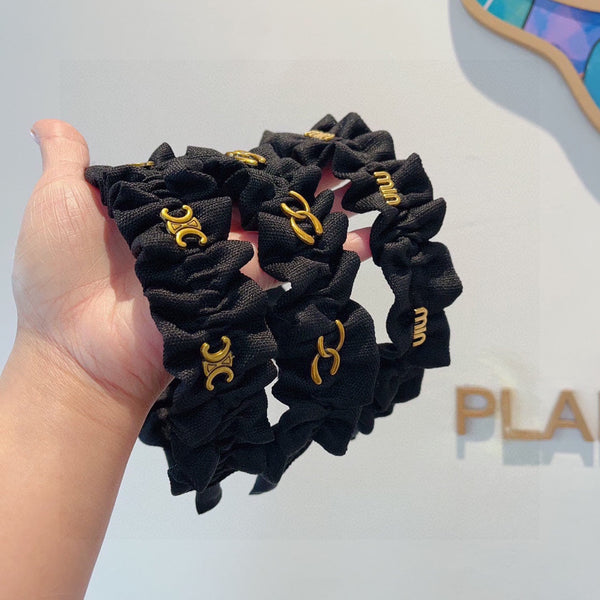 BLACK FABRIC WITH GOLD LOGO HAIRBAND 415931