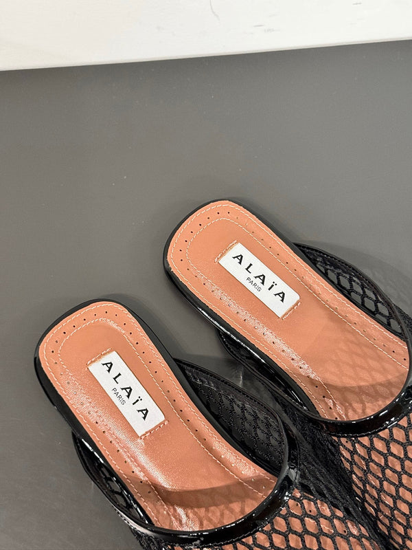 MULES ALAIA FLAT IN RETE NERA