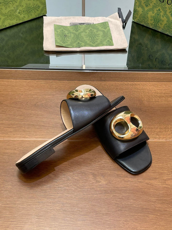 FLAT MULE IN BLACK CALFSKIN