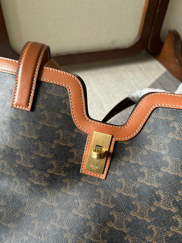 CABAS 37 IN TELA TRIOMPHE NERA E BORDI IN PELLE DI VITELLO MARRONE BRONZO CHIUSURA ORO