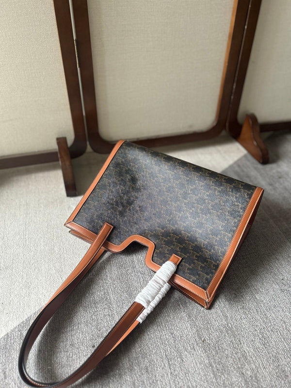 CABAS 37 IN TELA TRIOMPHE NERA E BORDI IN PELLE DI VITELLO MARRONE BRONZO CHIUSURA ORO