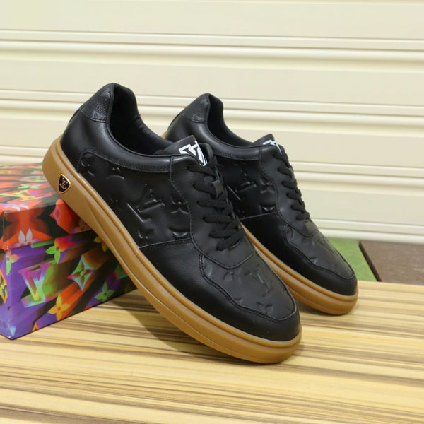 LV TRAINERS IN BLACK CALFSKIN AND BROWN RUBBER
