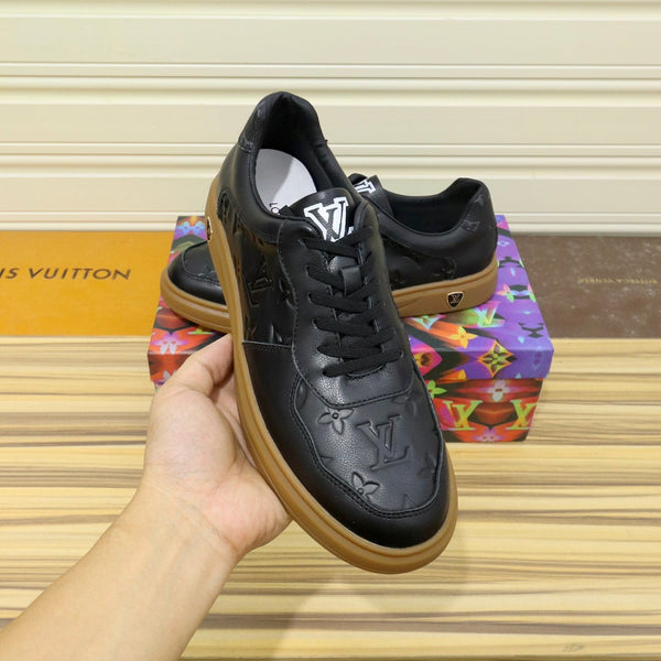 LV TRAINERS IN BLACK CALFSKIN AND BROWN RUBBER