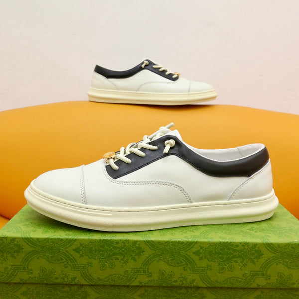 Sneaker da uomo GG in pelle di vacchetta nera e bianca 522970