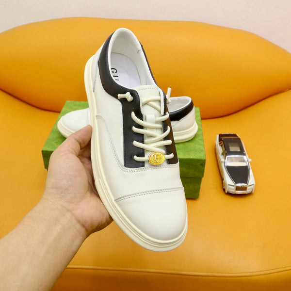 Sneaker da uomo GG in pelle di vacchetta nera e bianca 522970