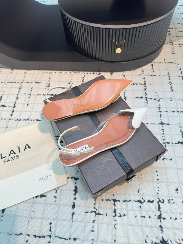 ALAIA FLAT SLINGBACK IN WHITE PATENT CALFSKIN AND FILM