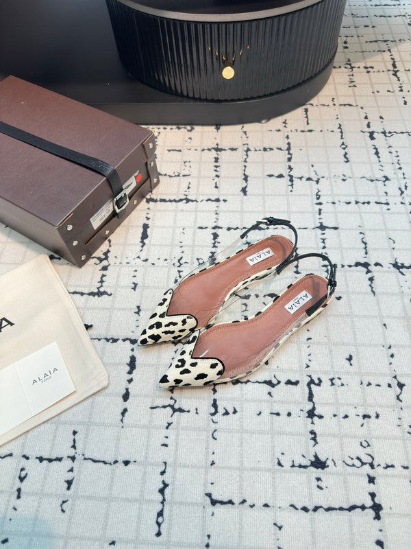 ALAIA FLAT SLINGBACK IN BLACK MIX WHITE PATENT CALFSKIN AND FILM