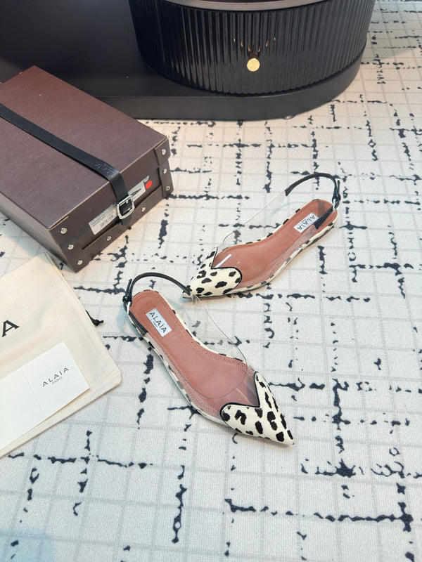 ALAIA FLAT SLINGBACK IN BLACK MIX WHITE PATENT CALFSKIN AND FILM