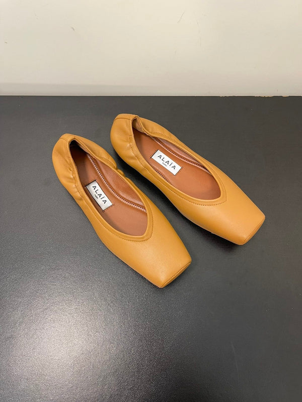 ALAIA BALLET FLATS IN COPPER BROWN SMOOTH CALFSKIN