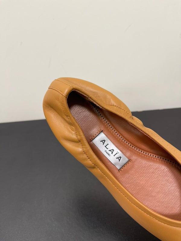 ALAIA BALLET FLATS IN COPPER BROWN SMOOTH CALFSKIN