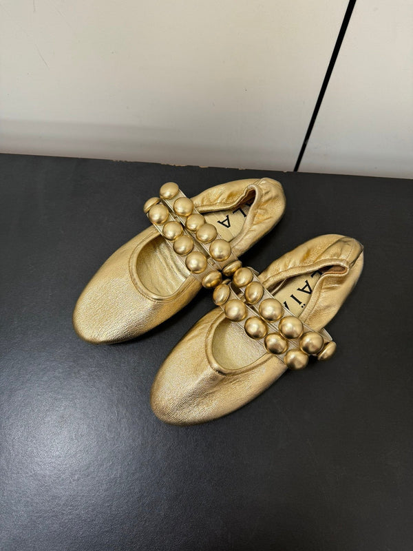 ALAIA SPHERE BALLET FLATS IN GOLDEN LAMBSKIN