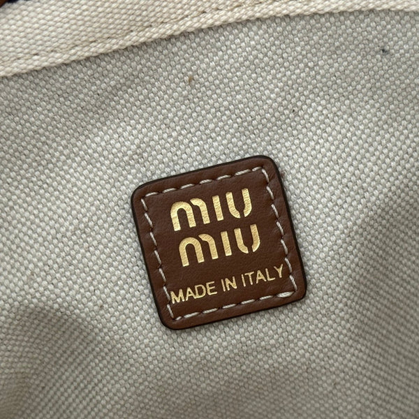 Sac seau rayé Miu Lucky en toile noire et crème