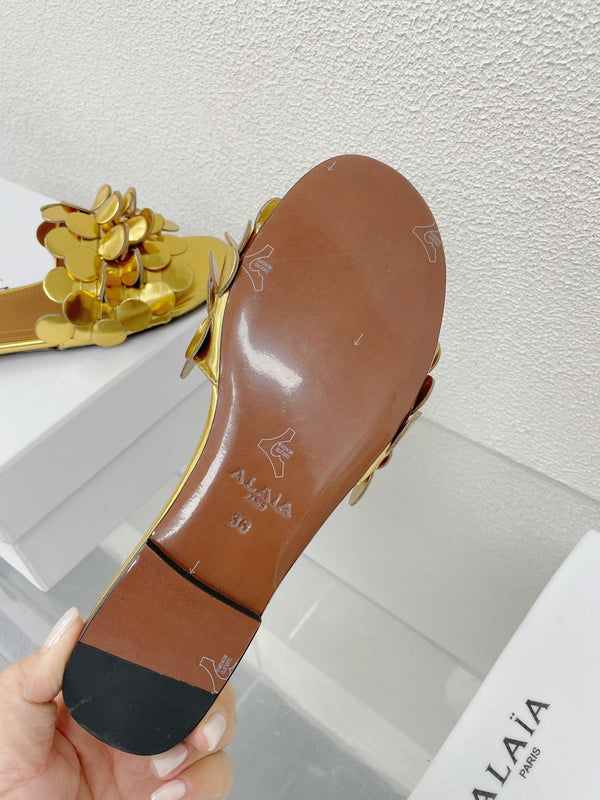 MULE PIATTA ALAIA IN PELLE DI AGNELLO LUCIDA DORATA