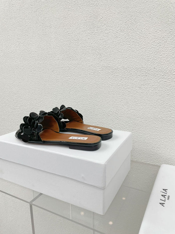 MULE PIATTA ALAIA IN PELLE DI AGNELLO NERA LUCIDA