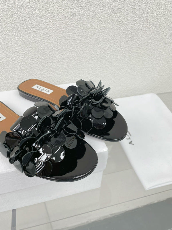 MULE PIATTA ALAIA IN PELLE DI AGNELLO NERA LUCIDA