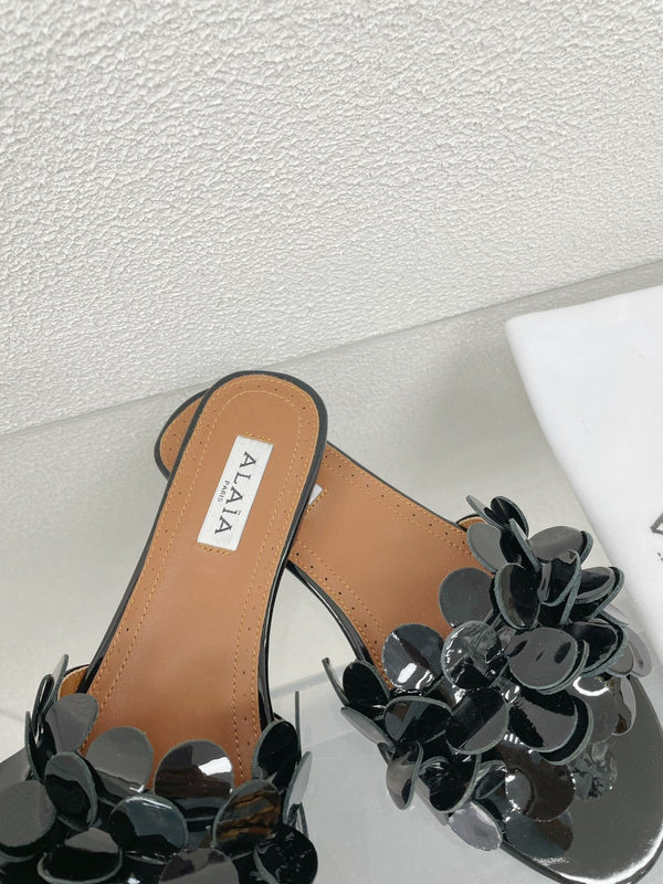 MULE PIATTA ALAIA IN PELLE DI AGNELLO NERA LUCIDA