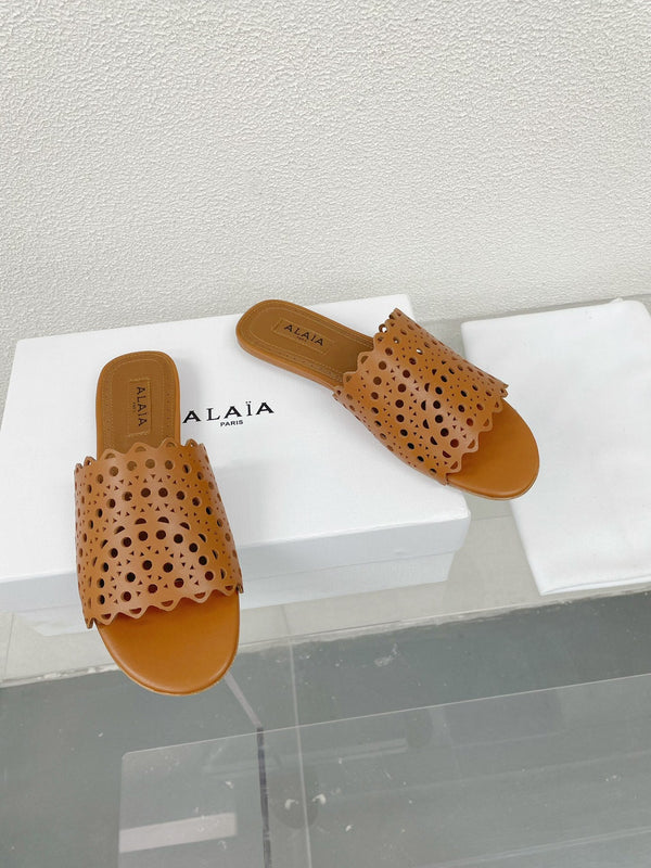 ALAIA VIENNE FLAT MULES IN CHOCOLATE BROWN LAMBSKIN