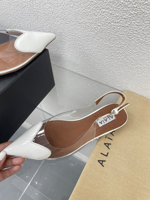 ALAIA LE COEUR FLAT SLINGBACKS IN WHITE PATENT LAMBSKIN