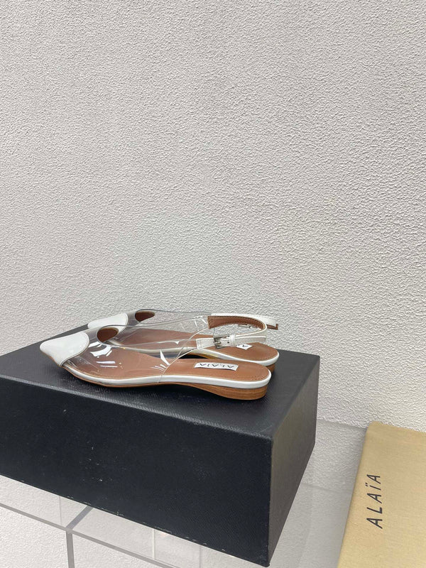 ALAIA LE COEUR FLAT SLINGBACKS IN WHITE PATENT LAMBSKIN