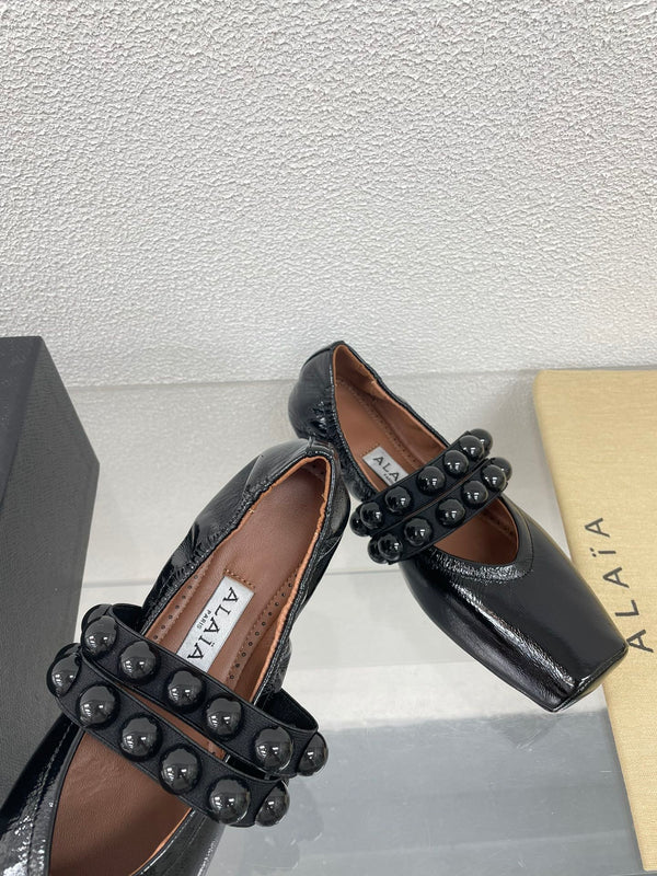 ALAIA MARY JANE PEARL IN GLOSSY BLACK LAMBSKIN