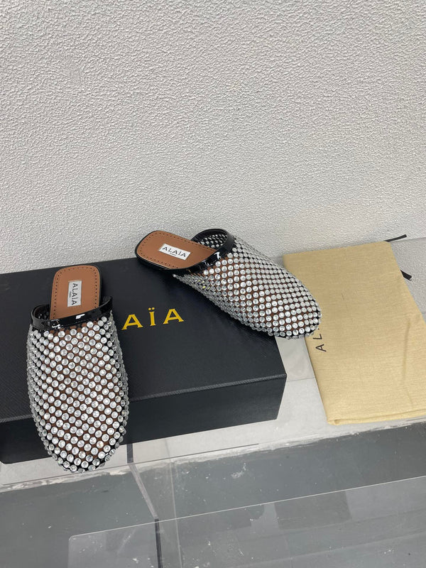 ALAIA FLAT MULES IN STRASS BLACK LAMBSKIN WITH RHINSTONES